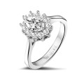 0.90 carat entourage ring in white gold with oval diamond