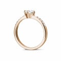 0.50 carat solitaire diamond ring in red gold with side diamonds
