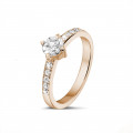 0.50 carat solitaire diamond ring in red gold with side diamonds