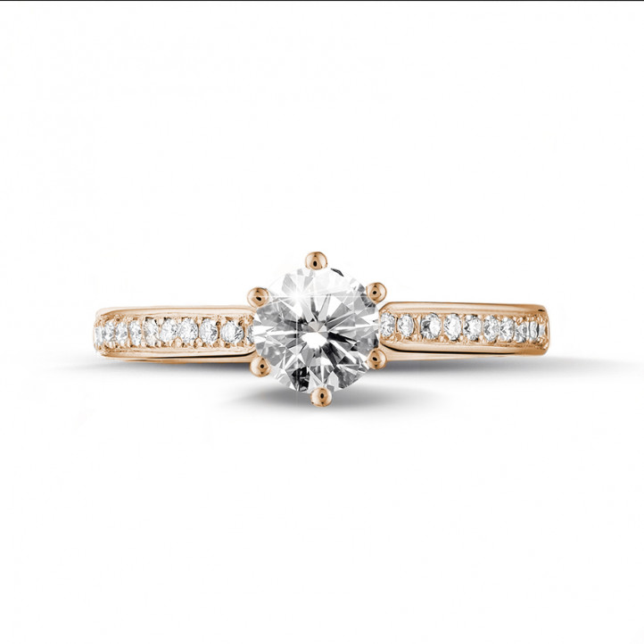 0.70 carat solitaire diamond ring in red gold with side diamonds