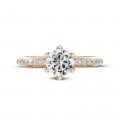 1.00 carat solitaire ring in red gold with side diamonds