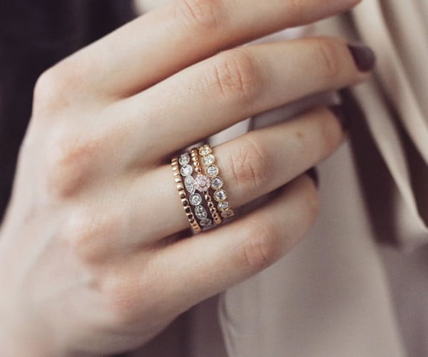 Person wearing diamond stackable rings