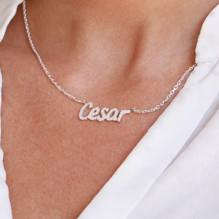 Customized name pendant in 18Kt gold with round diamonds
