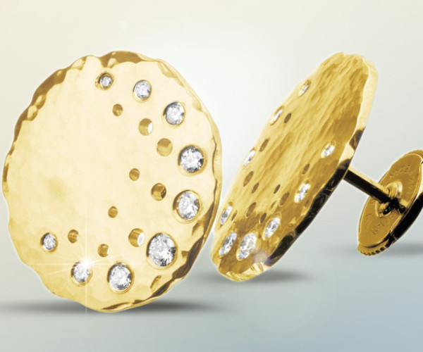 A pair of elegant gold-plated stud earrings adorned with sparkling diamonds, showcasing refined luxury and style.