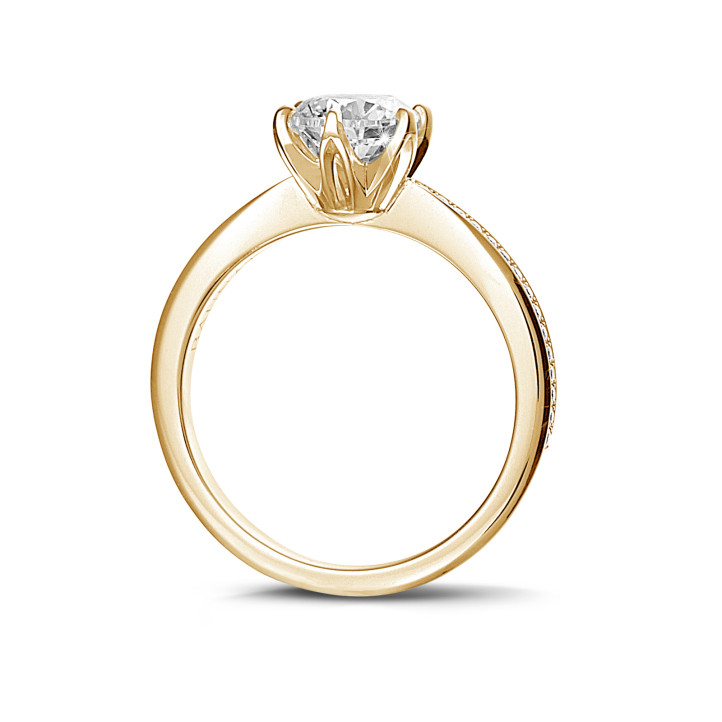 0.70 carat solitaire ring in yellow gold with side diamonds
