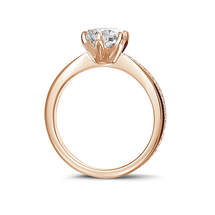 0.70 carat solitaire ring in red gold with side diamonds