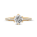 2.00 carat solitaire ring in yellow gold with side diamonds