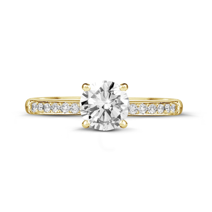 1.00 carat solitaire ring in yellow gold with four prongs and side diamonds