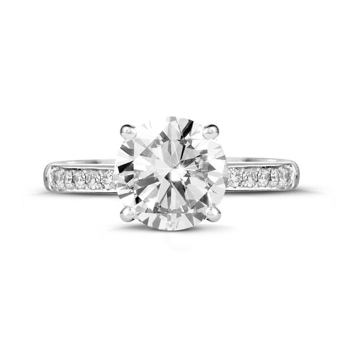 2.00 carat solitaire ring in platinum with four prongs and side diamonds
