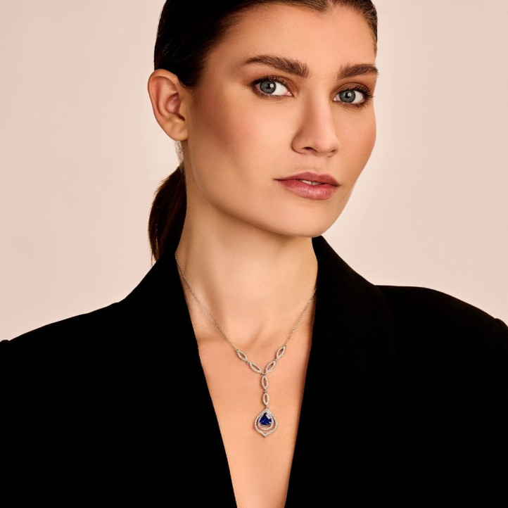 Diamond red golden necklace with a pear shaped sapphire
