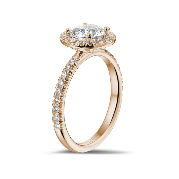 1.25 carat solitaire halo ring in red gold with round diamonds