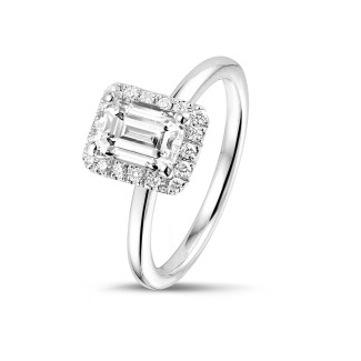Engagement - 1.00 carat solitaire halo ring with an emerald cut diamond in white gold with round diamonds