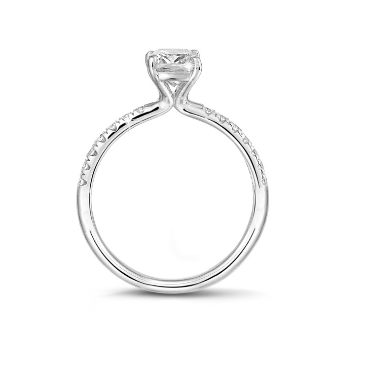 1.20 carat solitaire ring with an emerald cut diamond in white gold with side diamonds