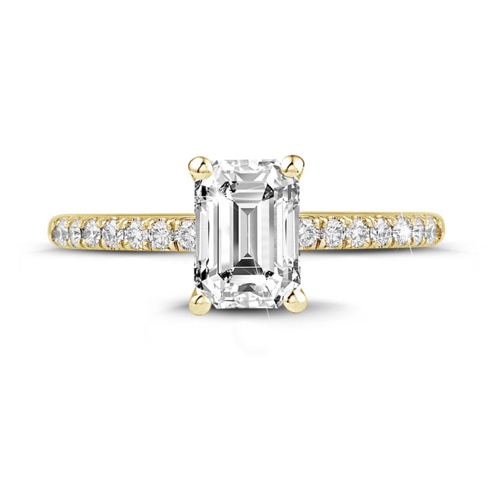 1.20 carat solitaire ring with an emerald cut diamond in yellow gold with side diamonds