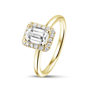 1.20 carat solitaire halo ring with an emerald cut diamond in yellow gold with round diamonds