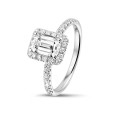1.20 carat solitaire halo ring with an emerald cut diamond in white gold with round diamonds