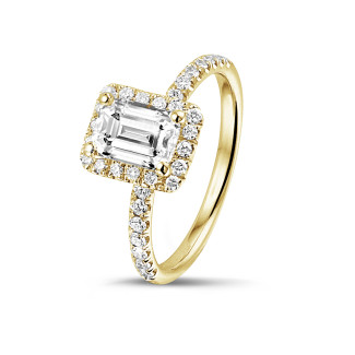 Engagement - 1.50 carat solitaire halo ring with an emerald cut diamond in yellow gold with round diamonds