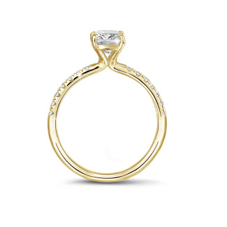Rings - 2.00 carat solitaire ring with an emerald cut diamond in yellow gold with side diamonds