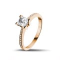 0.50 carat solitaire ring in red gold with princess diamond and side diamonds