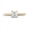 0.50 carat solitaire ring in yellow gold with princess diamond and side diamonds