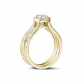 0.70 carat solitaire diamond ring in yellow gold with side diamonds