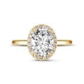 0.70Ct halo ring in yellow gold with oval diamond