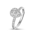 0.70Ct halo ring in white gold with pear diamond