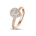 0.70Ct halo ring in red gold with pear diamond