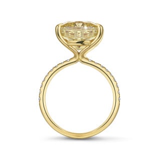Engagement - 7.07ct solitaire ring in yellow gold with ‘fancy intense yellow’ cushion diamond and side stones