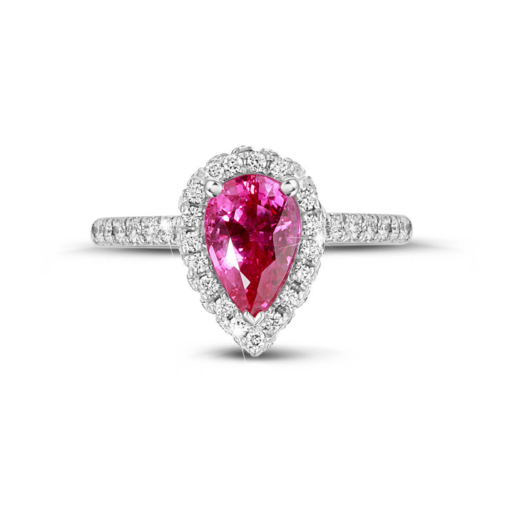 Halo ring in white gold with a pink, pear cut sapphire and round diamonds