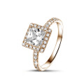 0.70 carat solitaire halo ring with a princess diamond in red gold with round diamonds