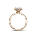 1.50 carat solitaire halo ring with a princess diamond in red gold with round diamonds
