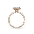 1.50 carat solitaire halo ring with a princess diamond in red gold with round diamonds