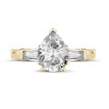1.00 carat trilogy ring in yellow gold with pear diamond and tapered baguettes