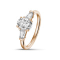 1.00 carat trilogy ring in red gold with oval diamond and tapered baguettes