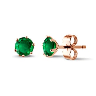 Earrings in red gold with emerald