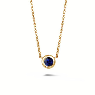 Satellite pendant in yellow gold with a round sapphire