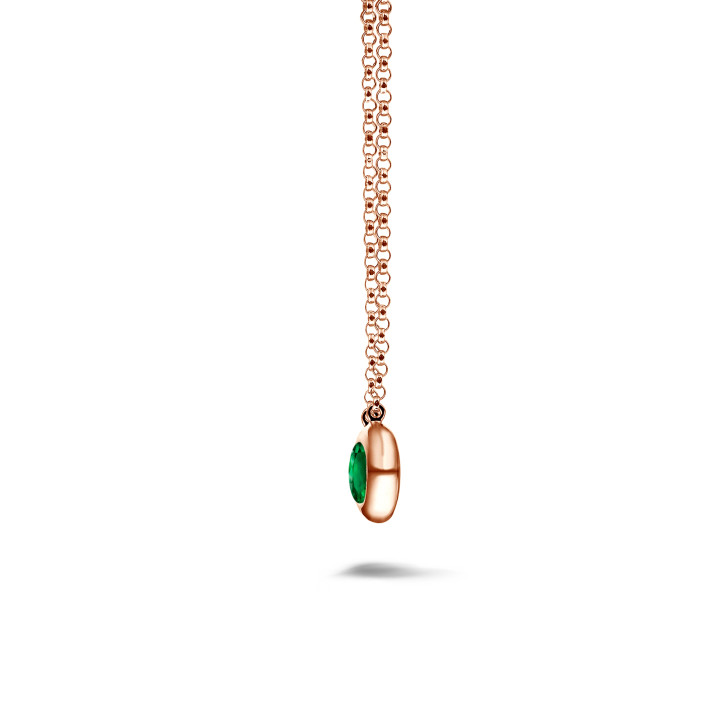 Satellite pendant in red gold with a round emerald