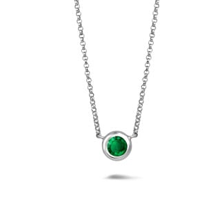 Satellite pendant in white gold with a round emerald