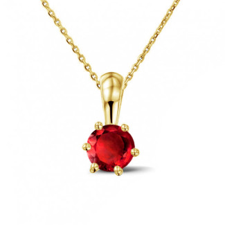 Solitaire pendant in yellow gold with a round ruby