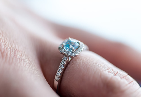 woman wearing an engagement ring on her left hand, bringing her lifelong fortune