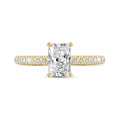 1.50 carat solitaire ring with a radiant cut diamond in yellow gold with side diamonds