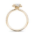 2.00 carat solitaire halo ring with a radiant cut diamond in red gold with round diamonds