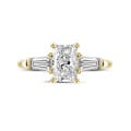 1.00 carat trilogy ring in yellow gold with a radiant cut diamond and tapered baguettes