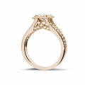0.70 carat solitaire ring in red gold with princess diamond and side diamonds