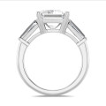 Bespoke trilogy ring with an emerald cut diamond and tapered baguettes