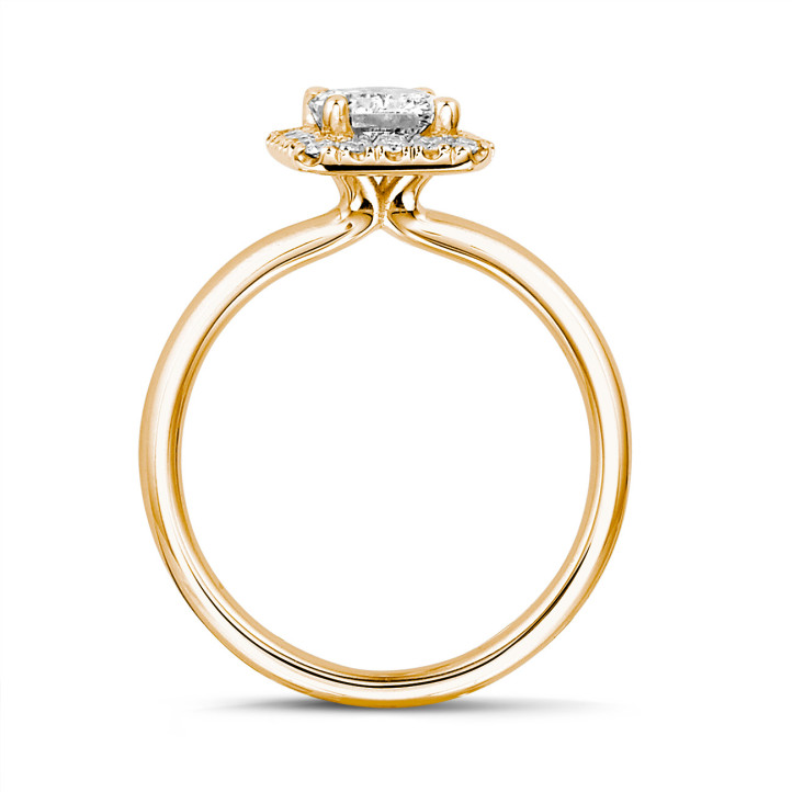 2.00 carat solitaire halo ring with a radiant cut diamond in red gold with round diamonds