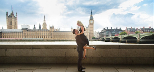 A man and woman pose together in front of Big Ben in London, a great place for jewellery shopping 