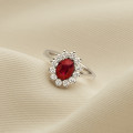 Entourage ring in white gold with an oval ruby and round diamonds