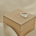1.00 carat solitaire ring in red gold with an emerald cut diamond and side diamonds